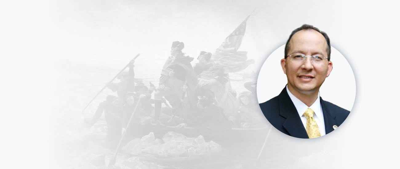 Attorney RJ in suit next to a faded image of Washington Crossing the Delaware